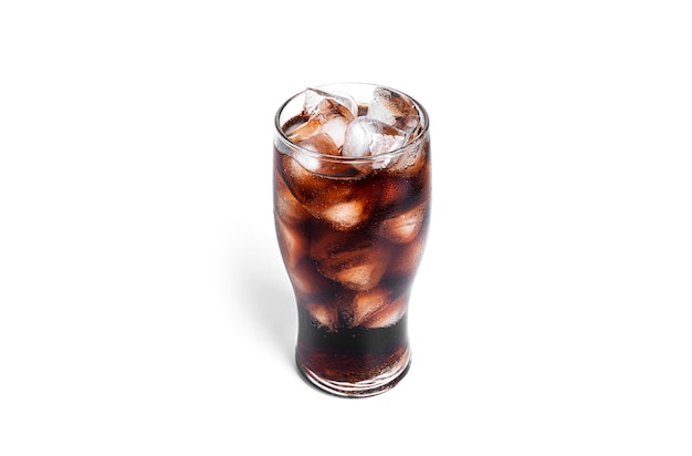 Soda with ice in a transparent glass isolated on a white background. High quality photo