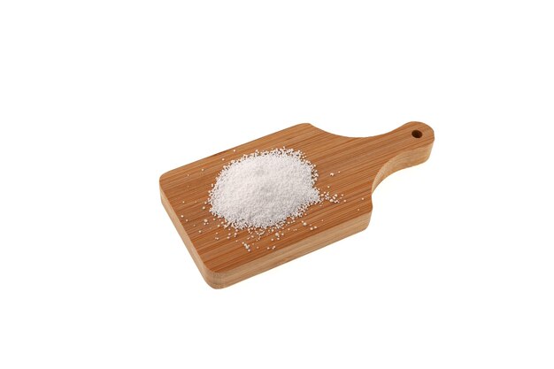 Sodium benzoate on cutting board. Sodium salt of benzoic acid. Food additive E211. Preservative.