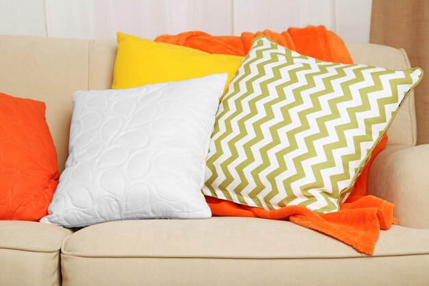 Sofa with colorful pillows in room