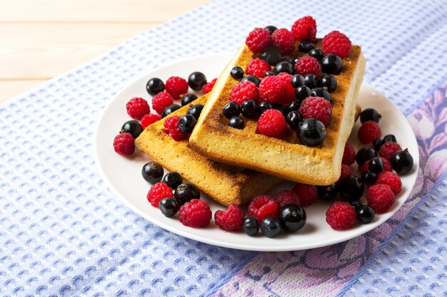 Soft Belgian waffles with blueberry, raspberry and blackcurrant