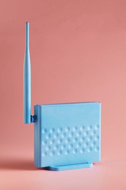 A soft blue router on pink background