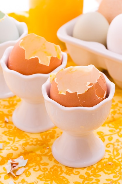 Photo soft boiled egg in egg cup and served with toast fingers.