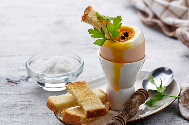 Soft-boiled egg and toasts 