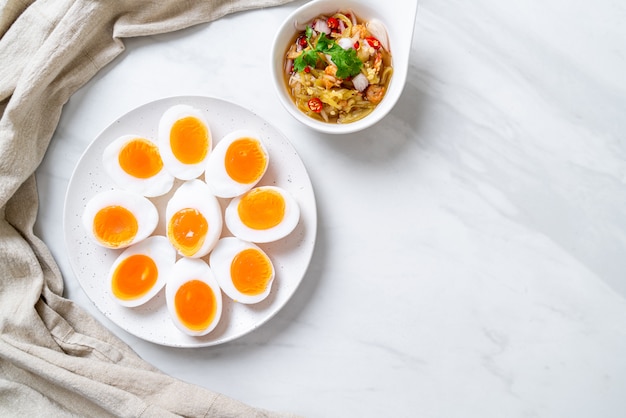 Soft boiled eggs and spicy salad