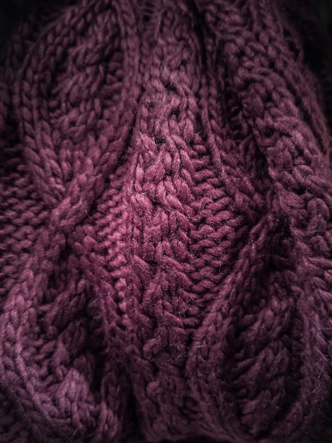 Soft burgundy woolen fabric close-up. 