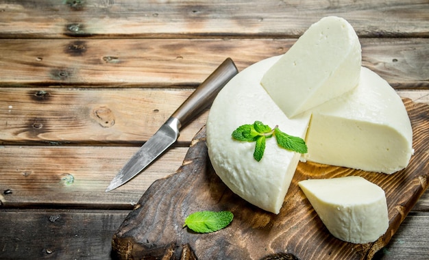 Soft cheese with mint leaves