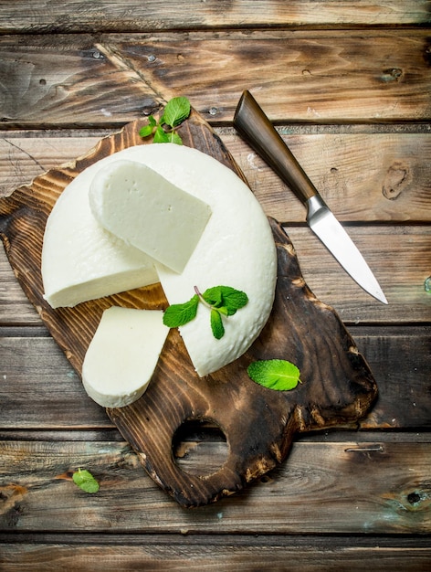 Soft cheese with mint leaves