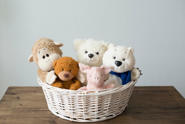 Soft children's animal toys in the basket