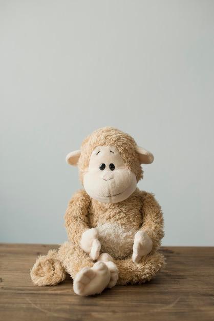 Soft children's toys monkey sitting on the table