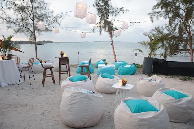 Soft colorful chair on beach near cafe