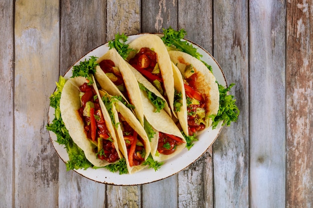 Soft corn tortillas with chili beans, beef and vegetable