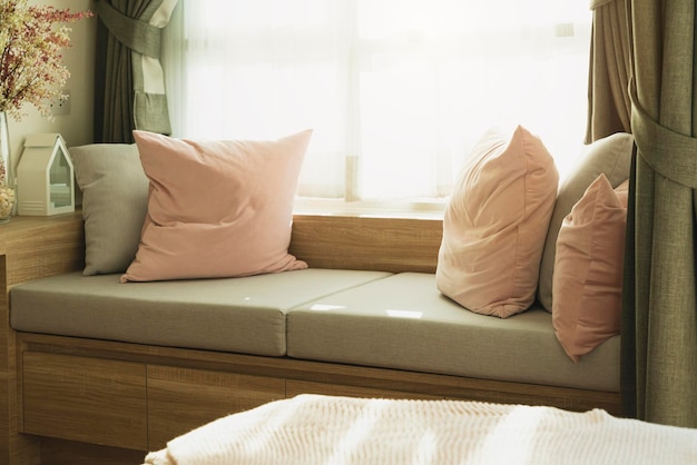 Soft cozy pillows on modern sofa background home design concept