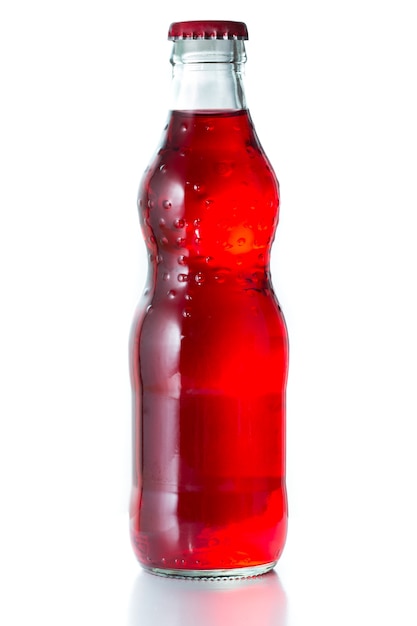 Soft drink, red color in glass bottle.