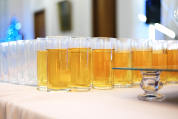 Soft drinks juices stand in a row on the buffet table