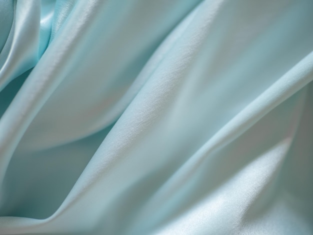 Soft fabric with beautiful folds of light color in a blur.