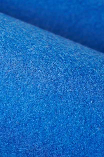 Soft felt textile material blue color colorful texture flap fabric background closeup