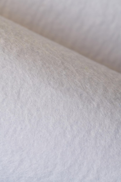 Soft felt textile material white color colorful texture flap fabric background closeup