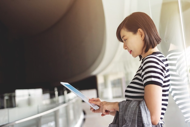 Soft focus of Business working woman reading data in digital tablet