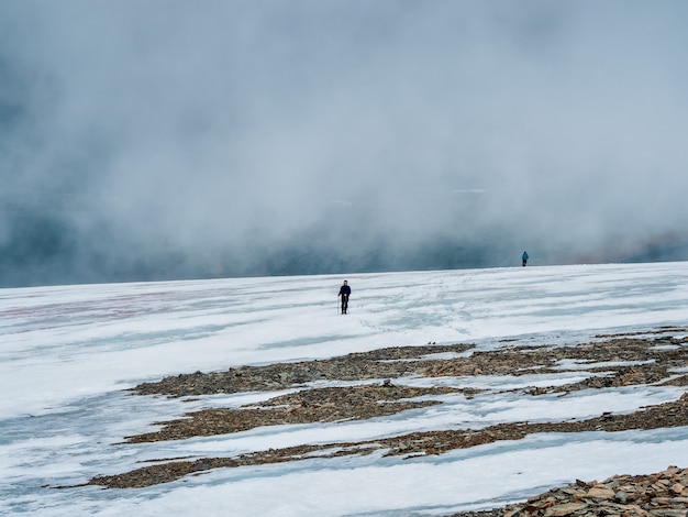 Soft focus. Difficult climb to the top of the mountain. Travel lifestyle, solo hiking hard track, adventure concept.