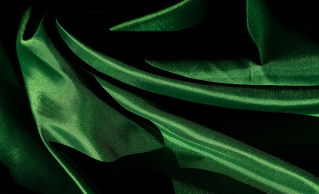 Foto messa a fuoco morbida del tessuto verde texture di sfondo astratto primo piano trama di stoffa