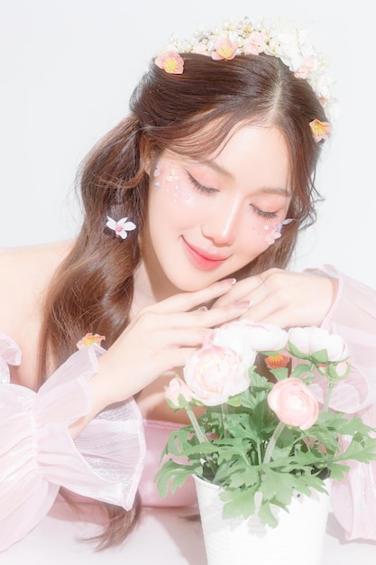 Soft focus Lovely Asian woman have perfect clear fresh skin with flower make up on her face over isolated white background Cosmetology beauty and spa wellness Plastic surgery