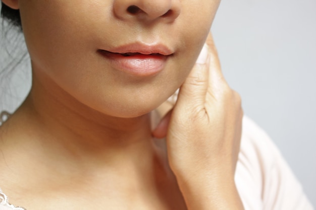 Soft focus of skin and lips without makeup of Asian girl.