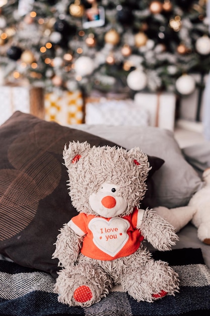 Soft gray teddy bear in the New Years room