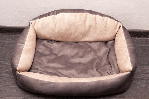 Soft grey pet bed isolated on a white background Accessories for pets