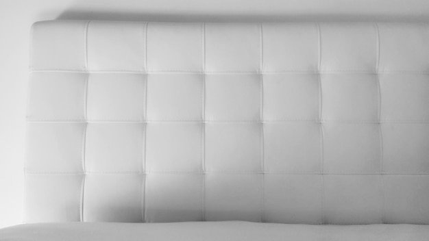 Soft headboard upholstery for furniture made of genuine or artificial leather and quilted fabric