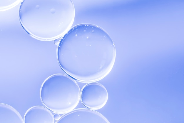 Foto morbide bolle di luce blu e gocce incandescenti