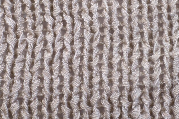 Soft light natural texture of knitted wool textile material\
background white crochet cotton fabric woven canvas