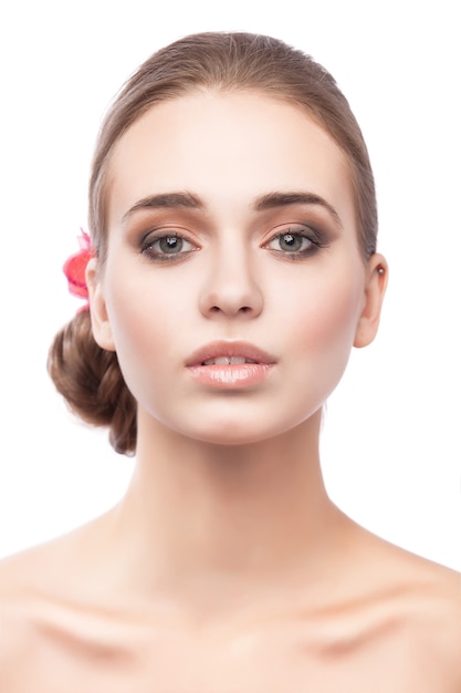 Soft portrait of young beautiful girl is isolated on a white background