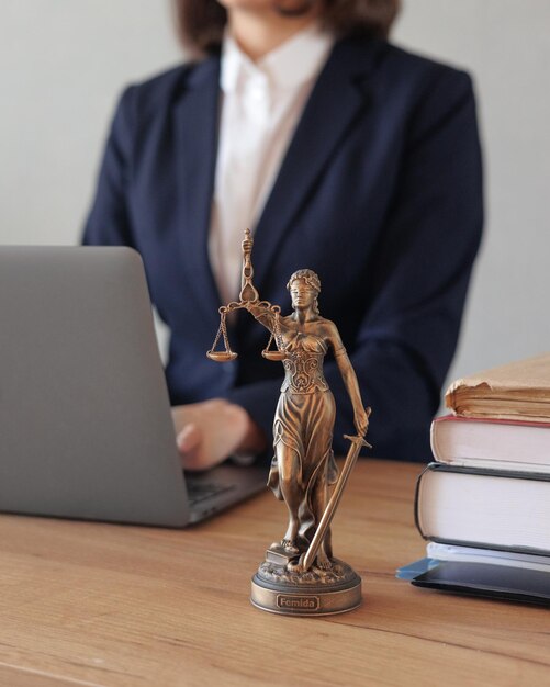 Soft selective focus female lawyer conducts an online consultation from a laptop via video link for