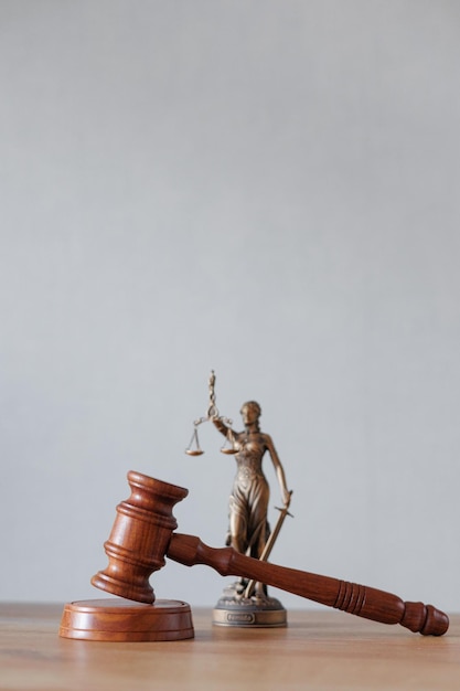 Soft selective focus the symbol of justice and justice is a statuette of the goddess themis judges