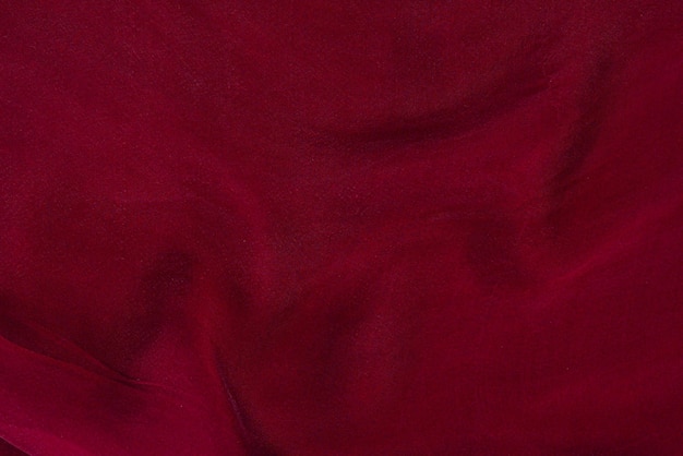 Soft smooth burgundy silk fabric background Fabric texture