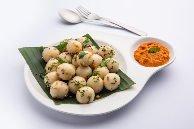 Soft and spongy Idli balls or goli idly with green and red chutney south indian food recipe