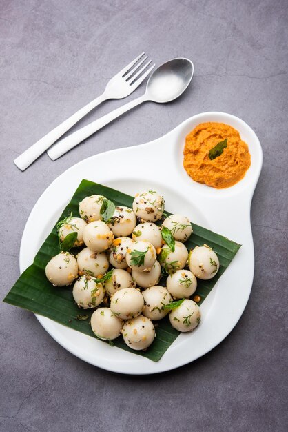 Soft and spongy Idli balls or goli idly with green and red chutney south indian food recipe