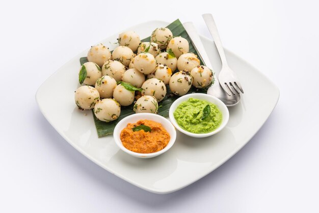 Soft and spongy Idli balls or goli idly with green and red chutney south indian food recipe