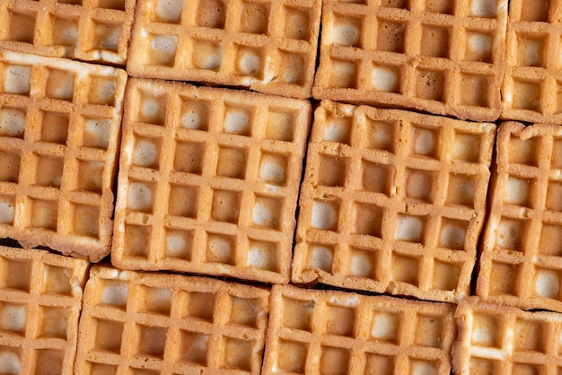 Soft sweet waffles on the table close up