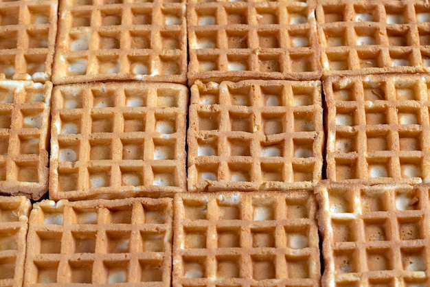 Soft sweet waffles on the table close up