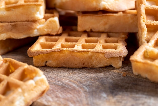 Soft sweet waffles on the table close up