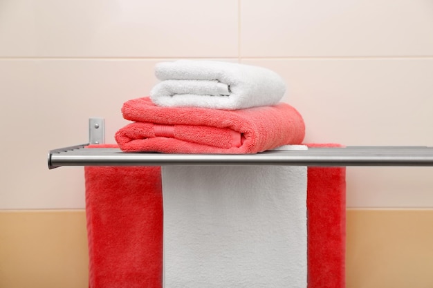 Soft towels on rack indoors