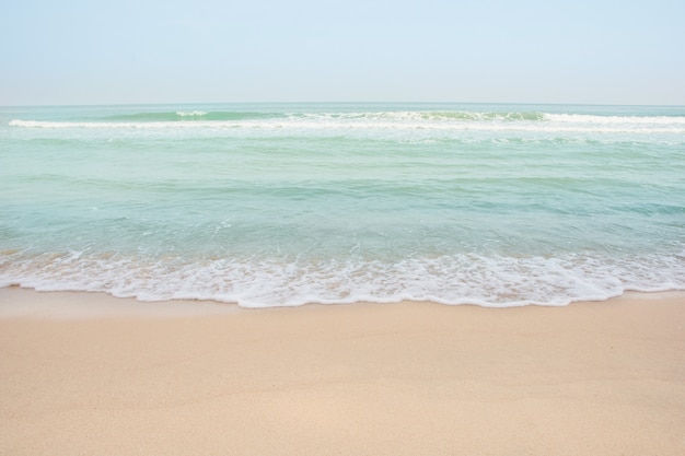 Soft wave of sea on empty sandy beach Background with copy space