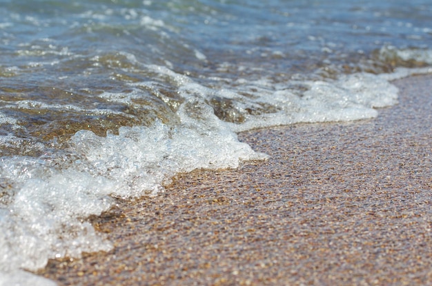 Soft wave of sea on sandy beach Background