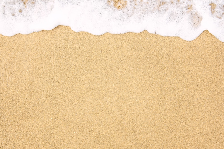 Soft wave of the sea on the sandy beach