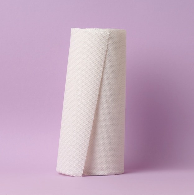 Soft white paper towel on a purple background, disposable kitchen towel