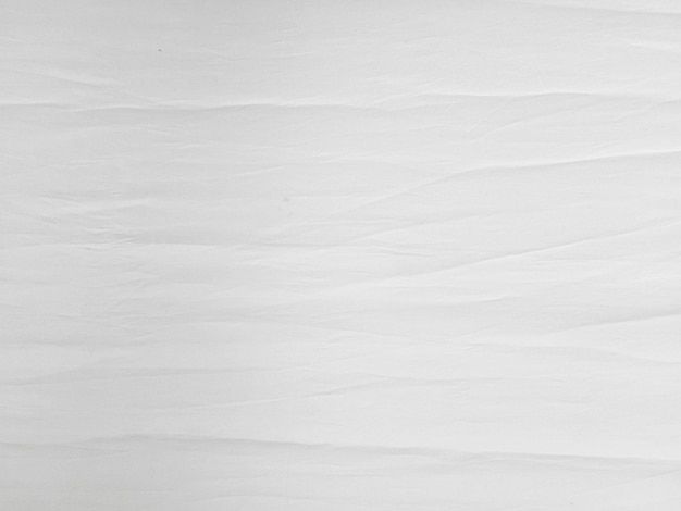 Photo soft white wrinkled fabric background