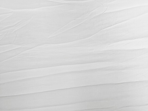 Photo soft white wrinkled fabric background