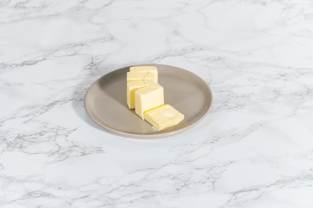 Softened sticks of unsalted butter on the kitchen counter