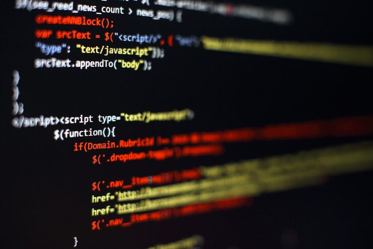 Photo software developer programming code. abstract computer script code. selective focus